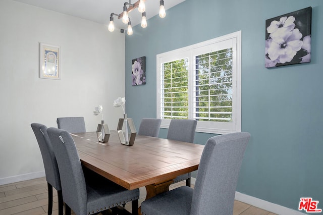 dining room with a chandelier and light hardwood / wood-style floors