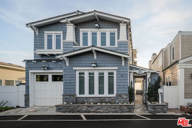 craftsman inspired home featuring a garage