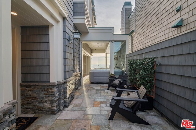 view of patio with a hot tub