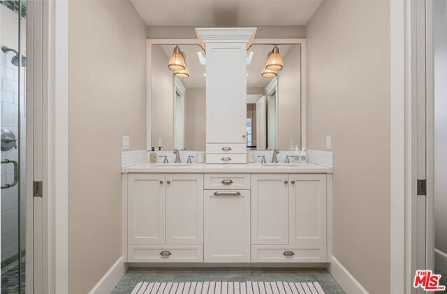 bathroom featuring vanity and a shower with shower door