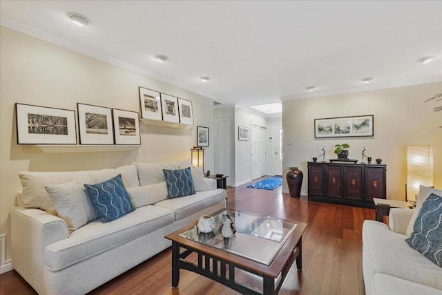 living room featuring dark wood-type flooring and ornamental molding