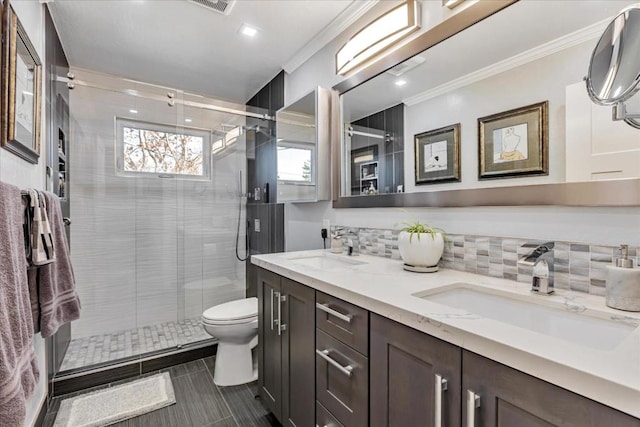 bathroom with ornamental molding, toilet, vanity, and decorative backsplash