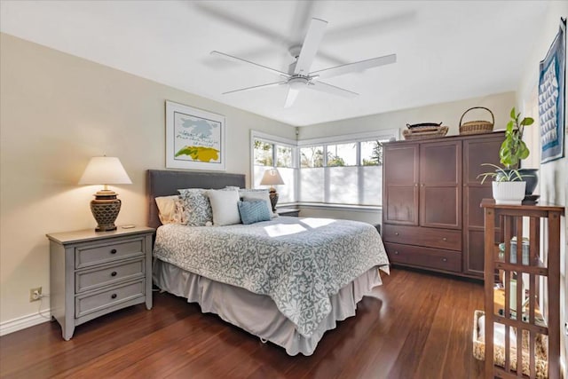 bedroom with dark wood-type flooring and ceiling fan