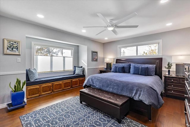 bedroom with dark hardwood / wood-style floors and ceiling fan