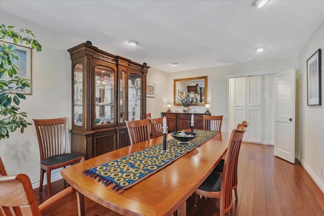 dining room with wood-type flooring