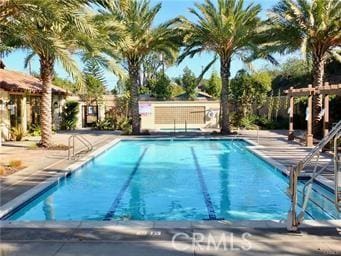 view of swimming pool featuring a patio area