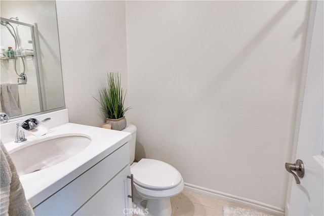 bathroom featuring tile patterned floors, toilet, and vanity