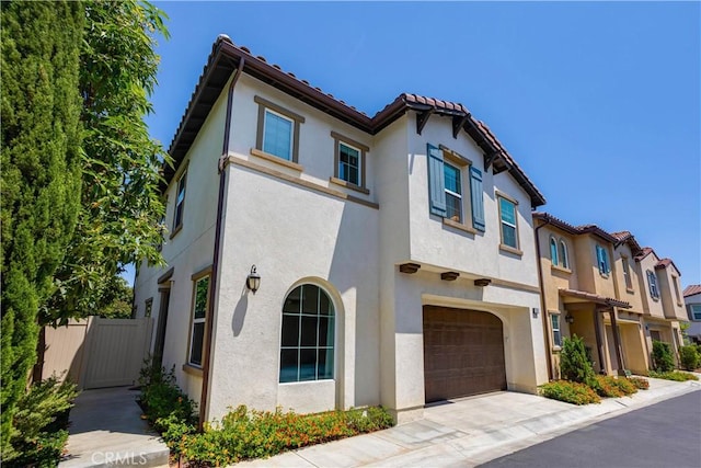 mediterranean / spanish-style home featuring a garage