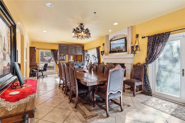 tiled dining area featuring a fireplace