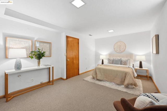 bedroom featuring light colored carpet