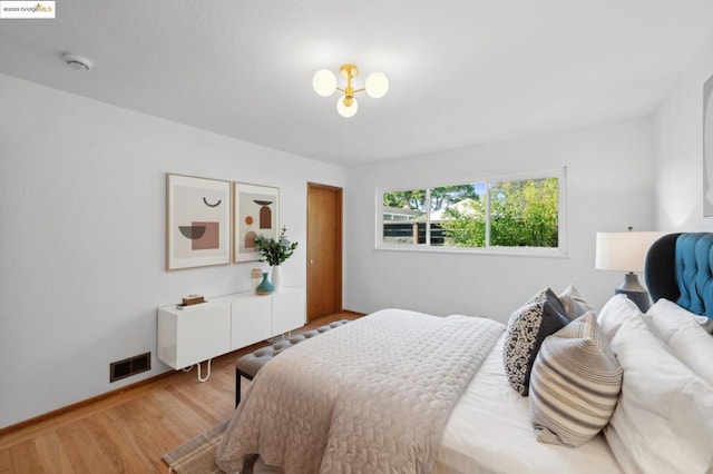 bedroom with hardwood / wood-style flooring