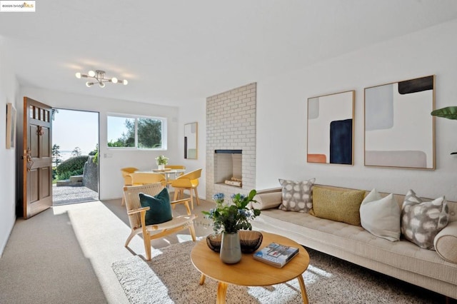 carpeted living room featuring a fireplace