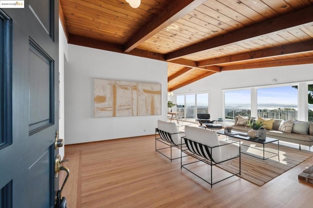 dining space featuring wooden ceiling, light hardwood / wood-style floors, and vaulted ceiling with beams