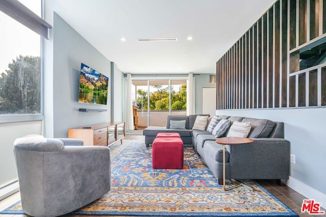 living room with hardwood / wood-style flooring and a baseboard radiator