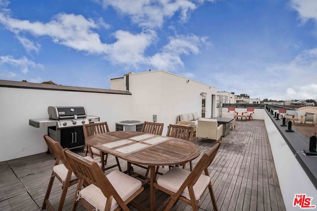 wooden deck featuring a grill, outdoor lounge area, and central air condition unit