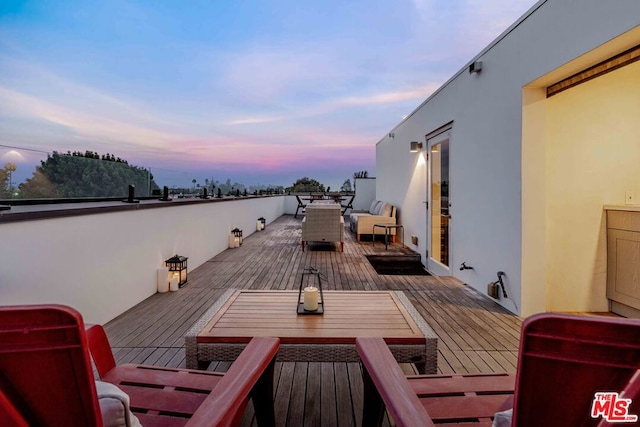 patio terrace at dusk with a deck