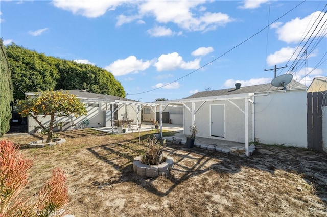 view of yard with a patio, a pergola, and a fire pit