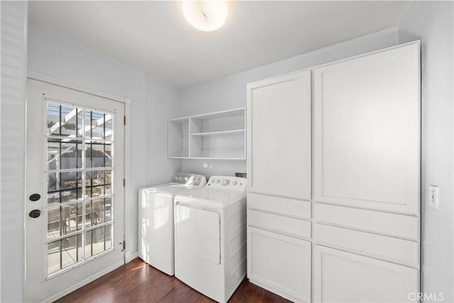 clothes washing area featuring washing machine and dryer and dark hardwood / wood-style flooring