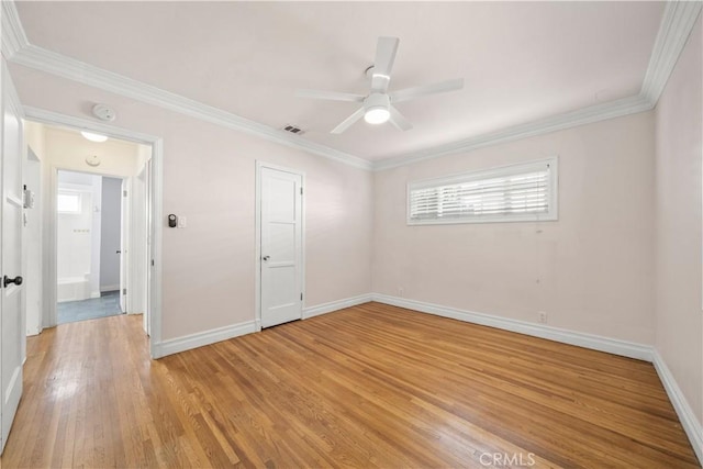 unfurnished room with ornamental molding, ceiling fan, and light hardwood / wood-style floors