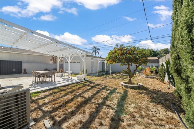 view of yard featuring cooling unit, a patio area, and a pergola