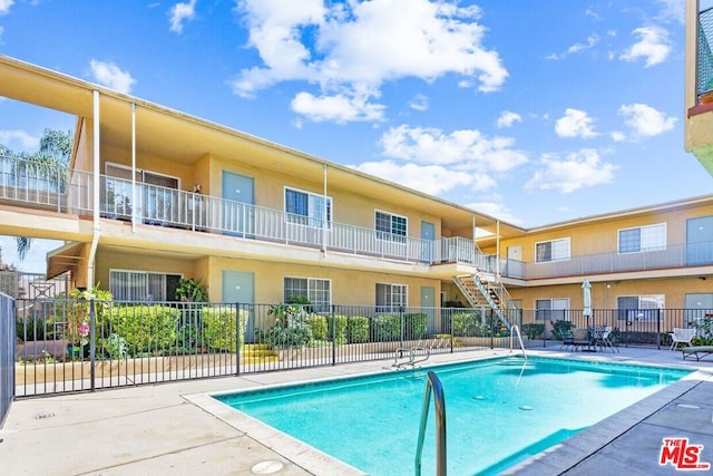 view of pool featuring a patio