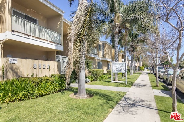 view of community featuring a yard