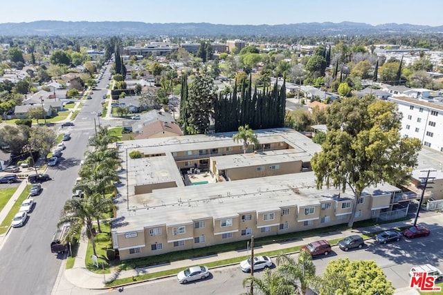 birds eye view of property featuring a mountain view