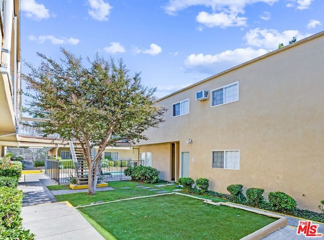 view of property featuring a wall mounted air conditioner