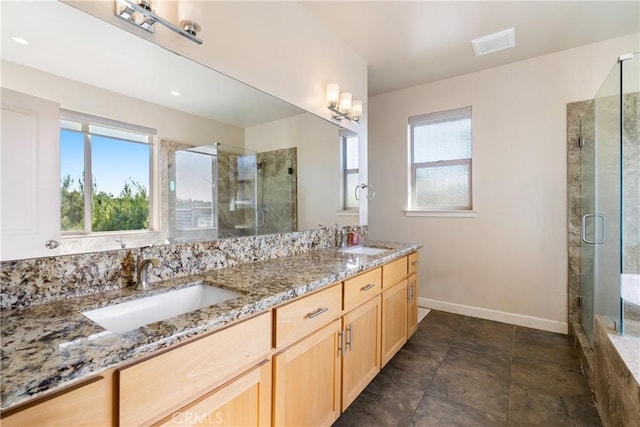 bathroom featuring vanity and an enclosed shower