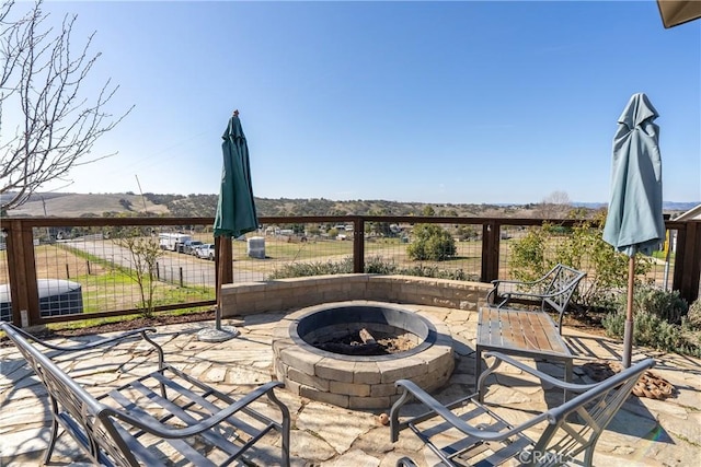 view of patio / terrace with an outdoor fire pit