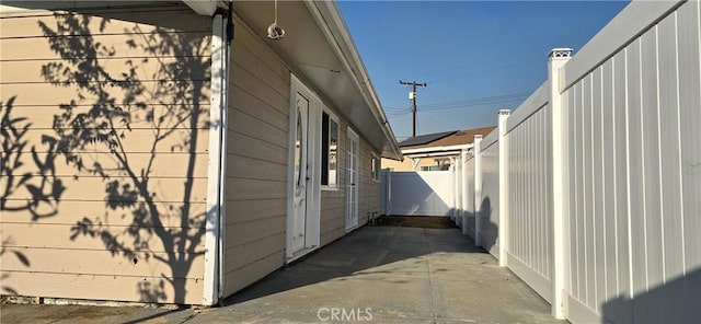 view of side of property featuring a patio