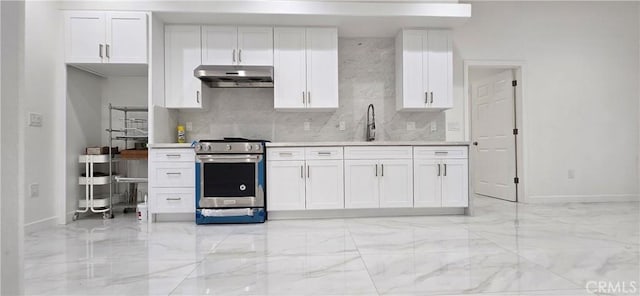 kitchen featuring white cabinetry, sink, stainless steel range, and decorative backsplash