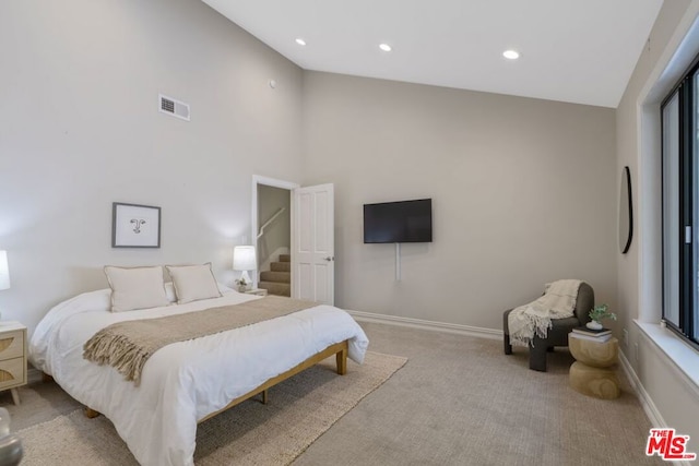 bedroom with light colored carpet