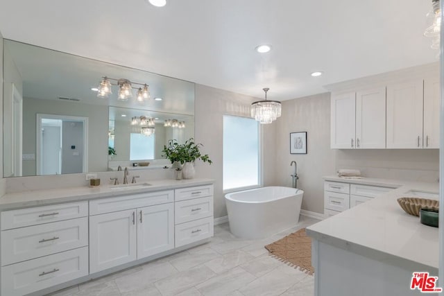 bathroom featuring vanity and a tub to relax in