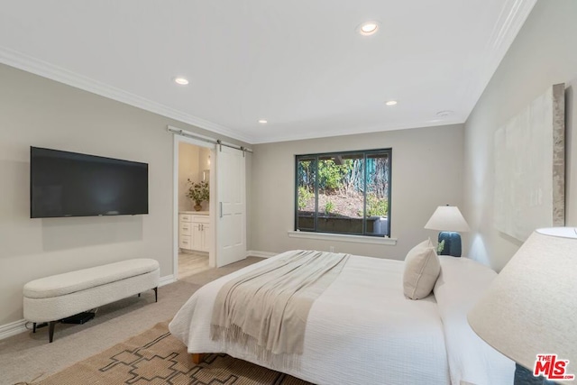 carpeted bedroom featuring connected bathroom, ornamental molding, and a barn door