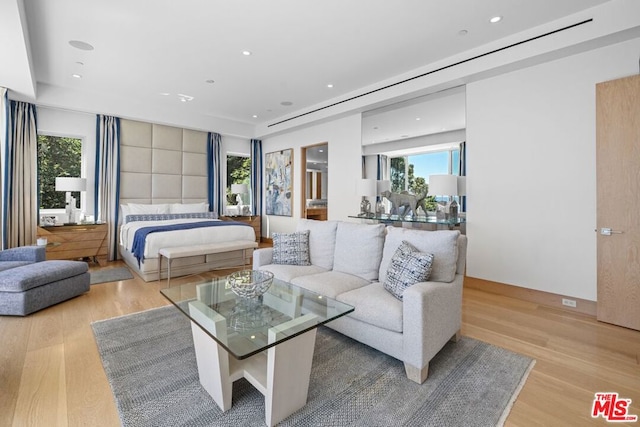 bedroom with light hardwood / wood-style flooring