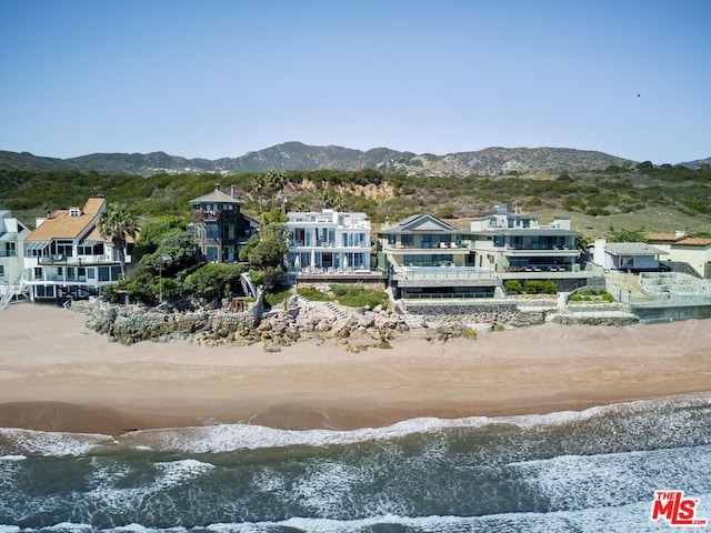 exterior space featuring a water and mountain view