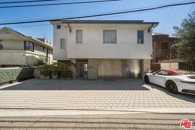 view of front of home with a garage