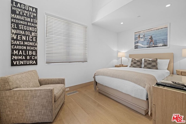 bedroom with light hardwood / wood-style flooring