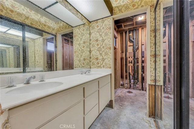 bathroom with vanity and concrete floors