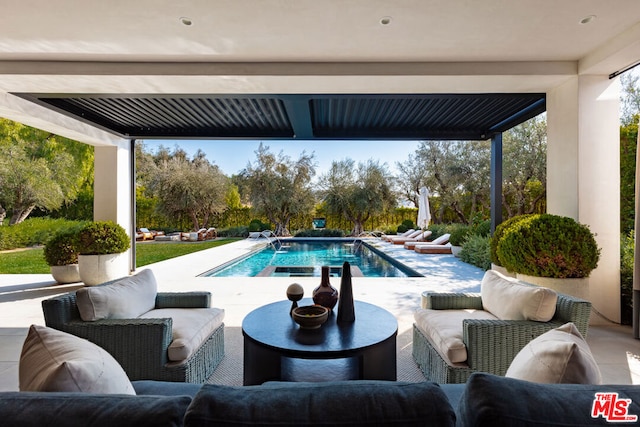 view of swimming pool with outdoor lounge area and a patio