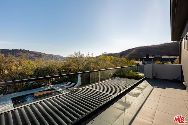 balcony featuring a mountain view