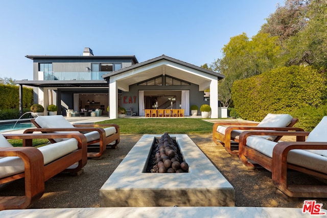 view of patio with an outdoor fire pit