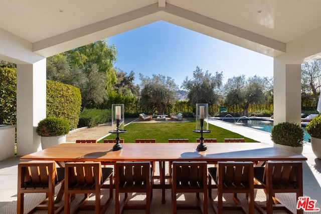 view of patio / terrace with pool water feature