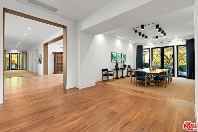 dining area featuring light wood-type flooring