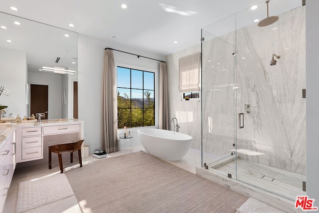 bathroom featuring vanity and plus walk in shower