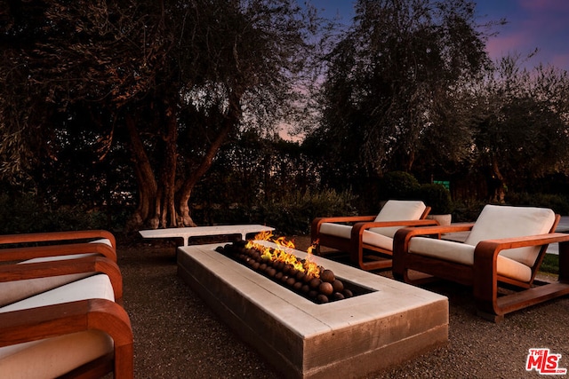 patio terrace at dusk with a fire pit