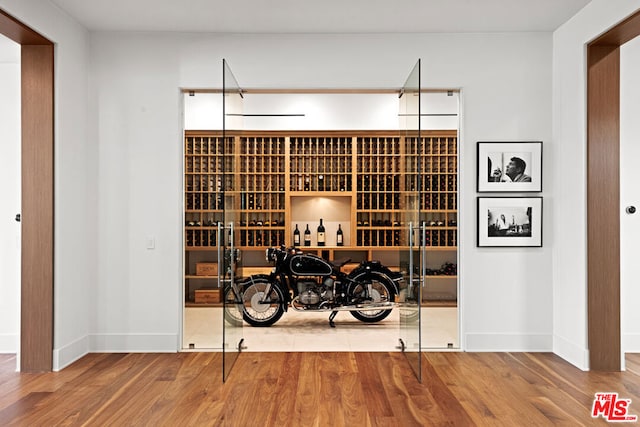 wine cellar featuring hardwood / wood-style flooring