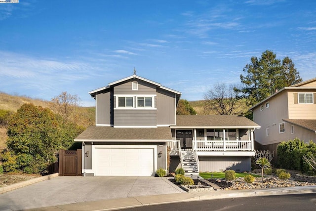 view of front of house featuring a garage and a sunroom