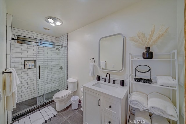 bathroom featuring vanity, toilet, and walk in shower